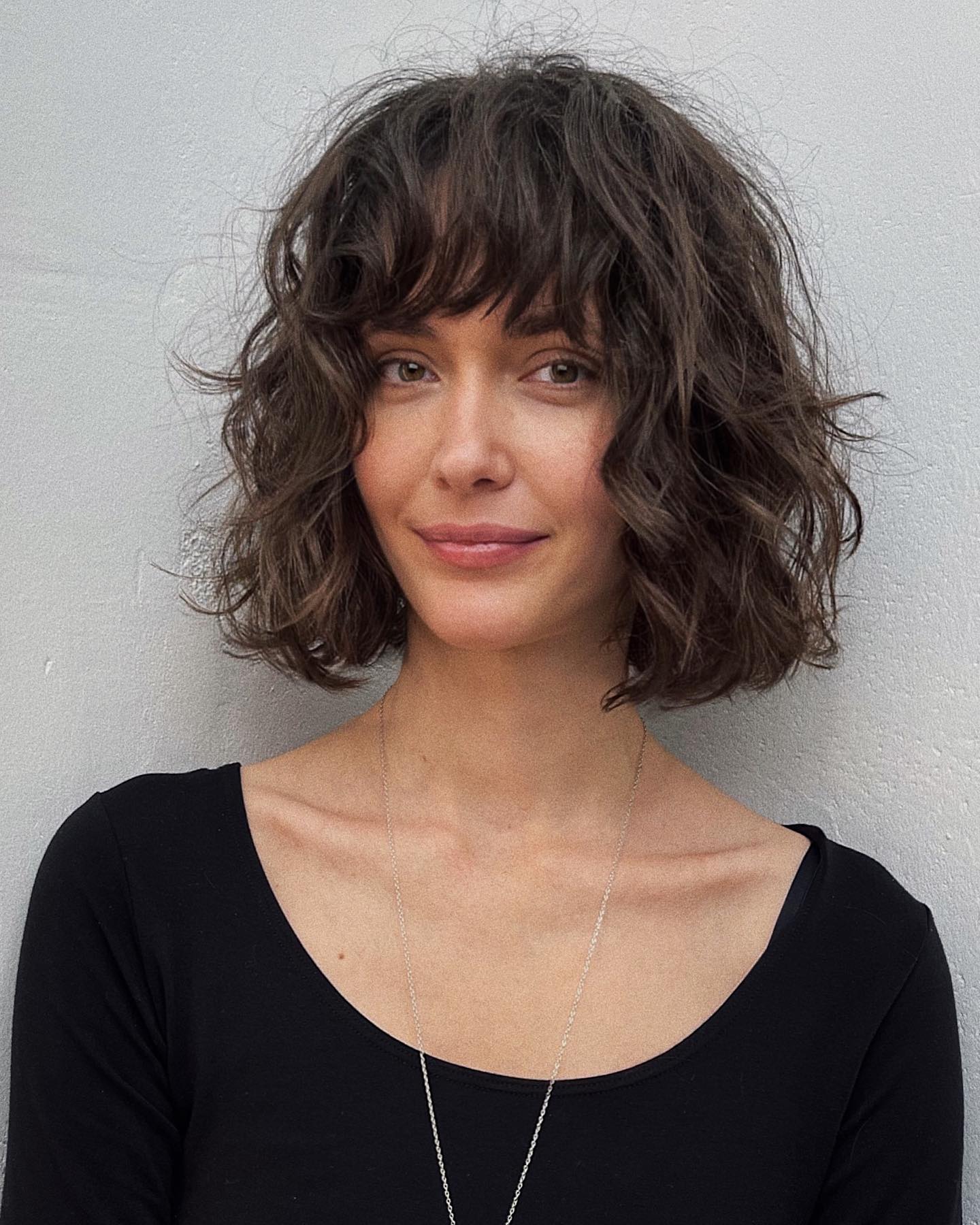 Wavy Bob with Bangs for Oval Faces